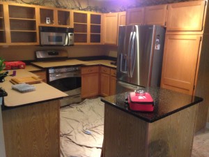 Before pic of old oak cabinets.