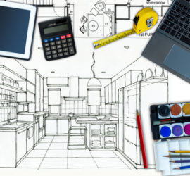 A black and white outline for a kitchen renovation project with a calculator, measuring tape, and other devices on top of it.