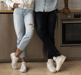 people standing in front of aluminum kitchen cabinets